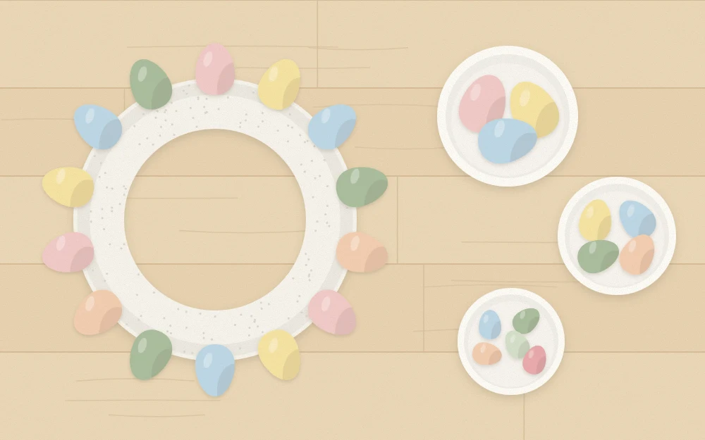 Foam wreath ring with a first row of eggs around the outer edge and bowls of sorted eggs
