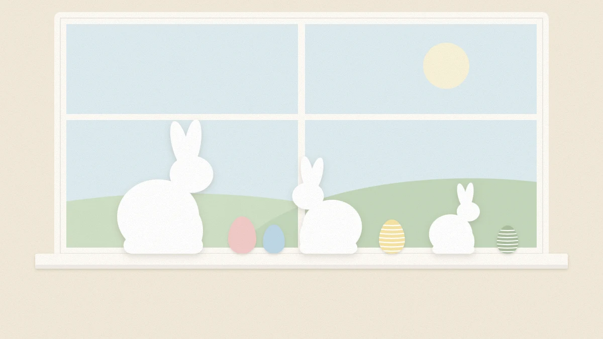 A window with three white paper bunny silhouettes of different sizes along the sill and paper eggs between them