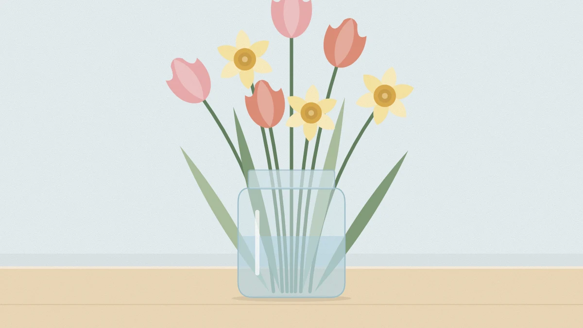Glass jar holding paper tulips in pink and coral and yellow paper daffodils with long green paper leaves